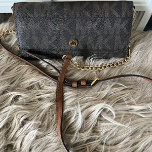 Michael Kors crossbody wallet on a chain